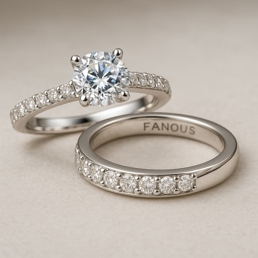 Close-up of a crisp diamond engagement ring and wedding band in white gold.